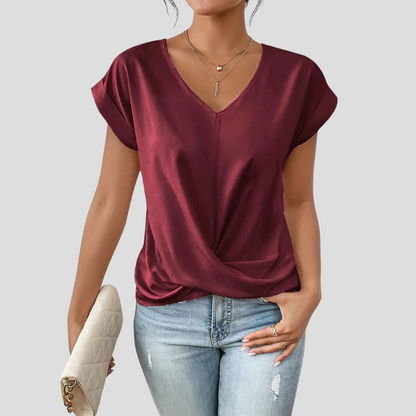 Camicetta da donna con scollo a V e orlo drappeggiato