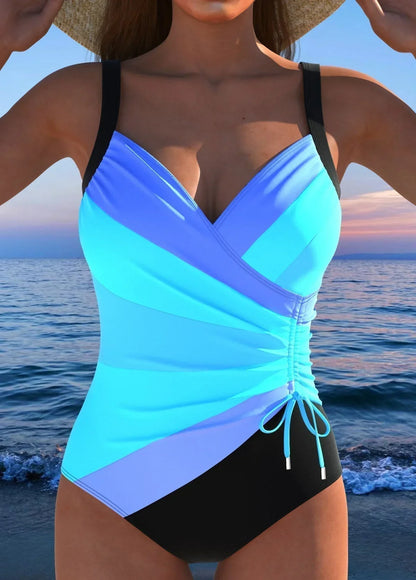Costume intero con scollo a V incrociato, contenitivo sul ventre e lato drappeggiato